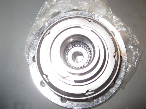 1994 Ford Probe - This is a close-up view of a metal automotive component, showing intricate internal splines and a bolted flange.