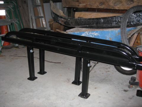 1994 Ford Bronco - A black metal rack with legs is shown in a garage setting.