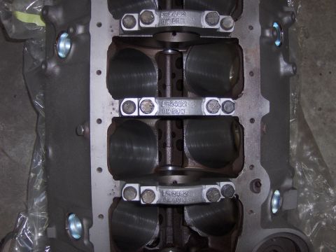 1970 Chevrolet Camaro - Close-up of engine block showing crankshaft and connecting rods with part numbers.
