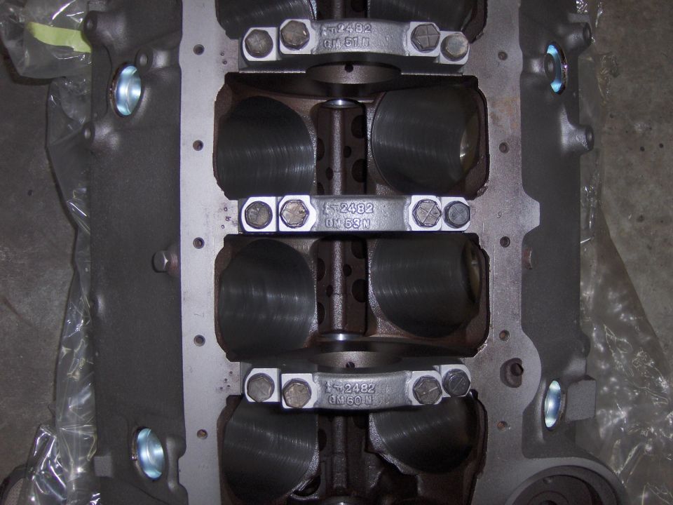 Engine block with crankshaft and connecting rods visible. Part number F-2482 is stamped on connecting rods