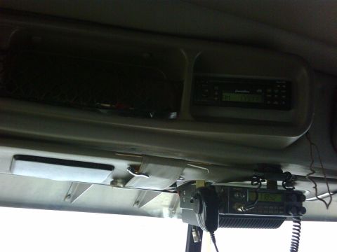 2003 Peterbilt 379 - Interior view of a truck's overhead console showing a CB radio and a stereo unit.