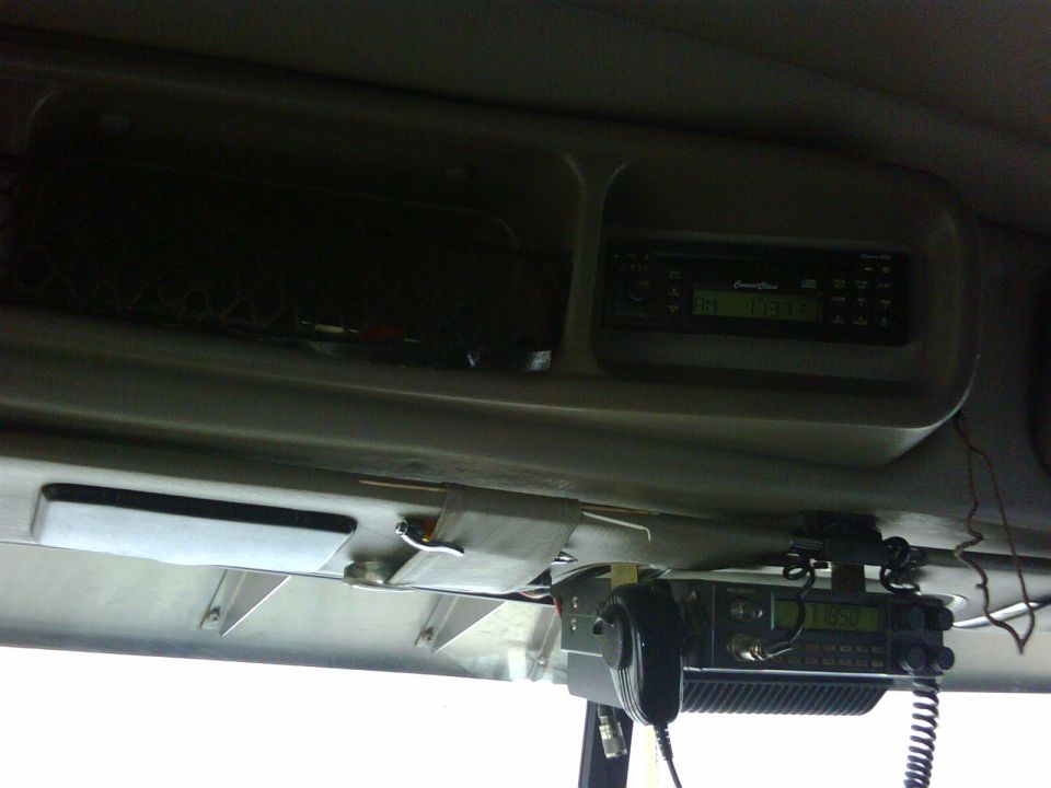 Semi truck overhead console with AM radio and CB radio with handheld mic on aluminum bracket