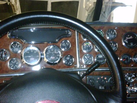 2003 Peterbilt 379 - Interior view of a truck's dashboard, showing numerous gauges and a steering wheel.