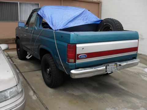 1989 Ford Bronco - Early '80's Bronco with no top in San Diego. It was raining,
