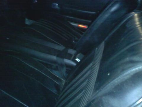 1968 Mercury Cougar - Interior view of a car's back seat and driver's seat, with a Supermotors watermark.