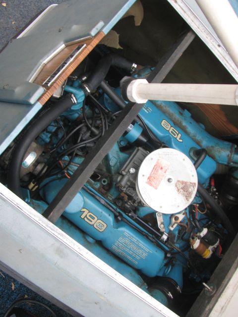 1968 Ford Mustang - Close-up view of a blue boat engine, with '190' and '6L' visible on the valve covers.