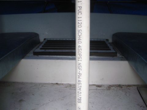 1968 Ford Mustang - Interior view of a boat, showing seating and a ventilation grate, with a PVC pipe running vertically.