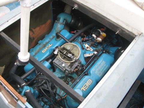 1968 Ford Mustang - Close-up view of a blue boat engine, identified by "190" and "36L" markings on its components.