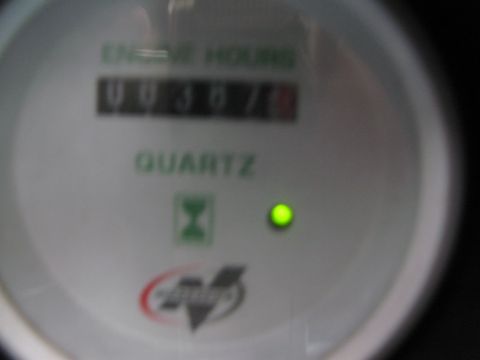 1968 Ford Mustang - Close-up of an engine hour meter displaying 00367 hours with a quartz movement indicator.