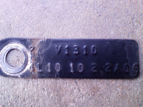 1996 Ford Bronco - This is an axle identification tag with stamped markings.