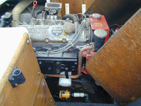 1968 Ford Mustang - Close-up view of a Volvo Penta AQ120 B marine engine, showing the carburetor, wiring, and oil filter.
