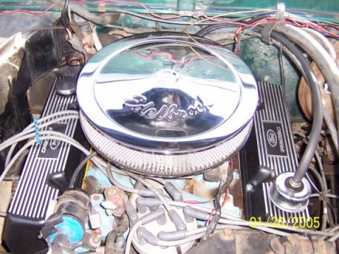 1979 Ford Bronco - Close-up view of an engine bay, showing aftermarket parts and wiring.