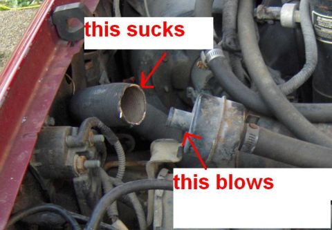 1992 Ford Bronco - The engine compartment shows a damaged hose and a rusty valve, indicating mechanical issues.