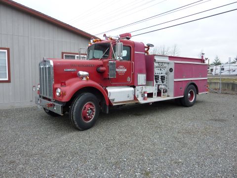1981 Kenworth W900A - This fire truck has 'FIRE DEPARTMENT' and 'KENWORTH' badging on its hood.