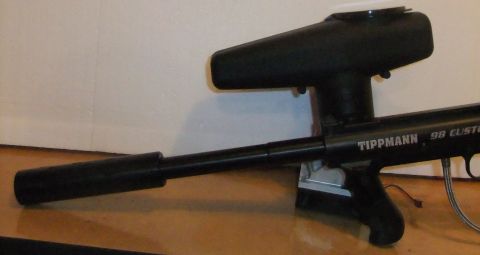 1978 Chevrolet C/K Pickup - A Tippmann 98 Custom paintball gun is shown from the side.
