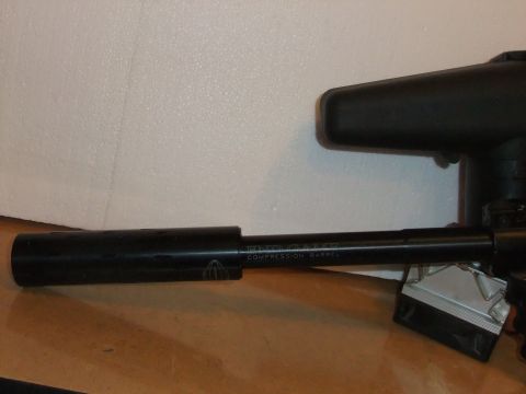 1978 Chevrolet C/K Pickup - Close-up of a paintball gun barrel, showing the 'COMPRESSION BARREL' marking.