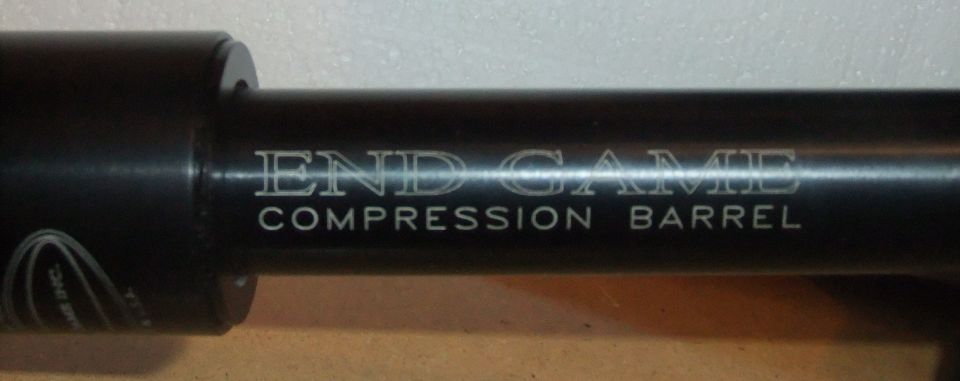 Black metal barrel with 'END GAME COMPRESSION BARREL' text and a Supermotors logo