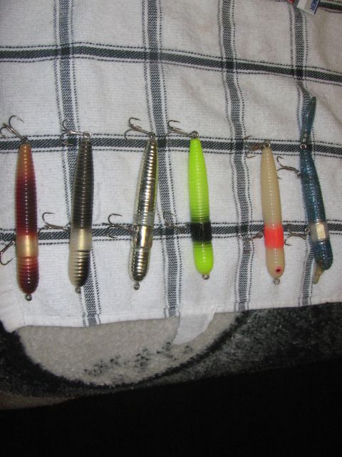 1968 Ford Mustang - A collection of fishing lures, varying in color and design, are displayed on a towel.