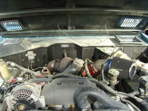 2007 Ford Mustang - Close-up view of a diesel engine bay, a "Power Stroke" engine and aftermarket modifications.