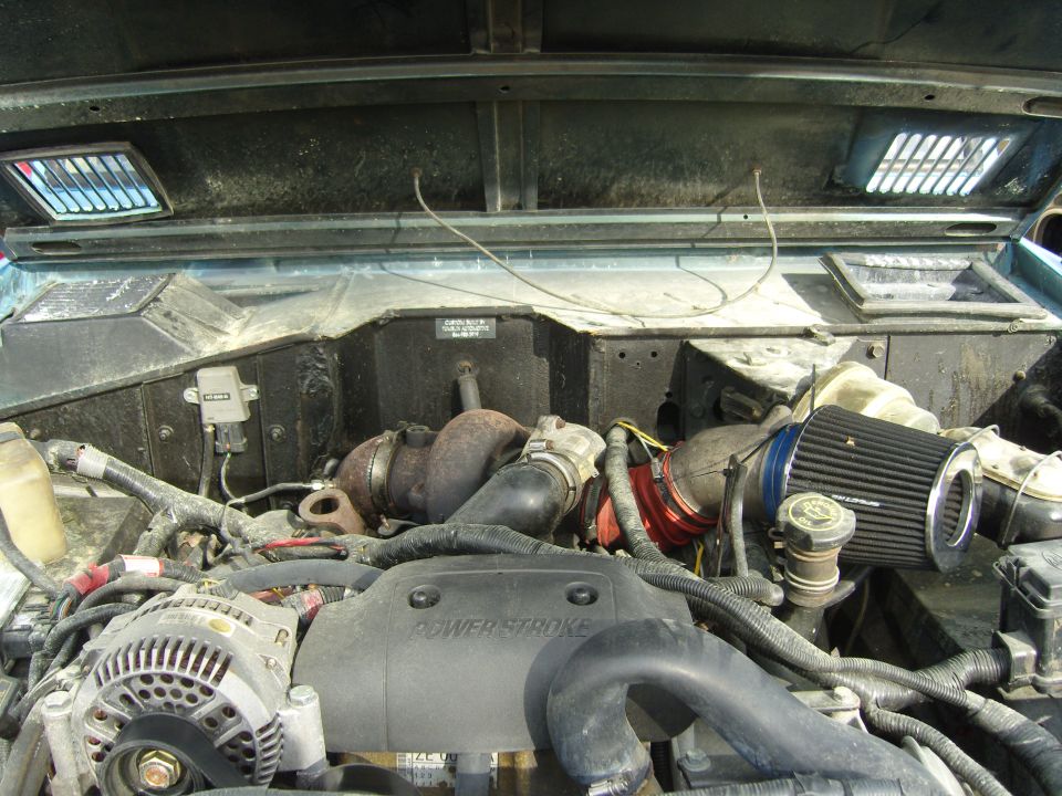 Engine bay with "Power Stroke" visible on the engine cover. Aftermarket air filter and turbo components are present