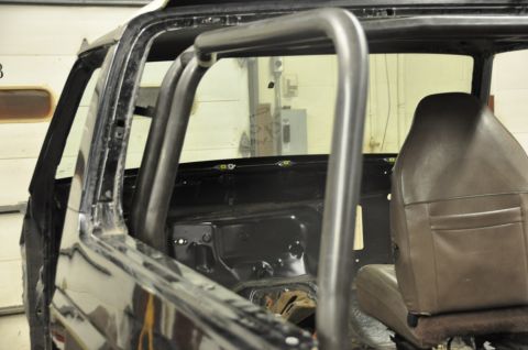 1996 Ford Bronco - Custom roll cage installation in progress inside a 1996 Ford Bronco.