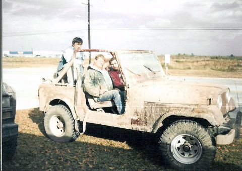 1983 Ford Bronco - A group of friends poses in a heavily soiled Jeep CJ, likely after an off-road excursion.
