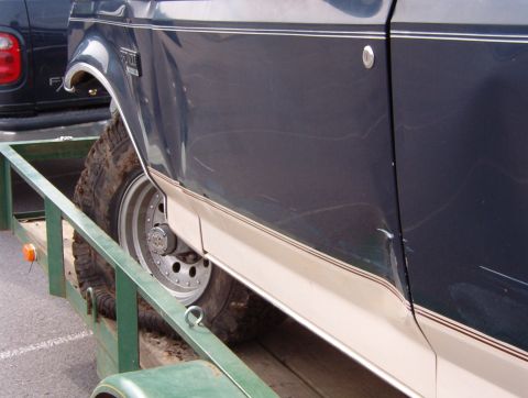 1993 Ford Bronco - The damage actually continues all the way to the rear wheel lip, but I hope it'll tap out back there. The door & fender are goners.