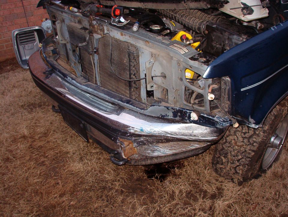 The hood, radiator, condenser, fan, wiper valance, grille, axle, shocks, sway bar, R headlight & door appear undamaged. The header panel, bumper, bumper valance, grille valance, rim, L fender, L door, L radius arm, L headlight & door will have to be replaced.