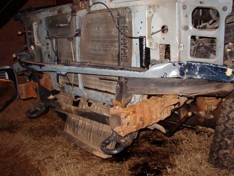 1993 Ford Bronco - Getting the bumper off the frame & out from behind the core support took some effort. The L light tab on the towing eye mount is severely t…