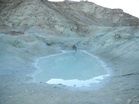 1997 Ford Ranger - A geothermal pool sits in a barren, rocky landscape with pale blue water.