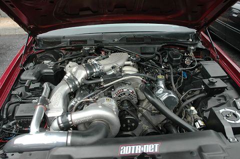 1992 Ford Crown Victoria - Customized engine bay of a 1992 Ford Crown Victoria, twin turbochargers and a prominent "aotR.net" decal.