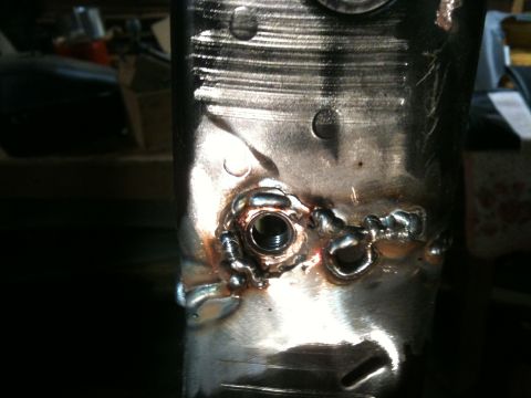 1995 Ford Bronco - Metal part shows evidence of welding and a threaded insert for repair.