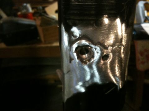 1995 Ford Bronco - This is a close-up of a metal component, possibly undergoing repair or modification.