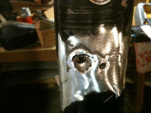 1995 Ford Bronco - Close-up of a metal part showing repair work on a threaded hole.