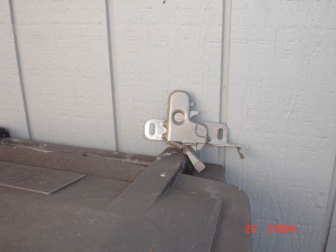 1978 Ford Mustang II - Close-up view of a hood latch mechanism, likely a replacement part.