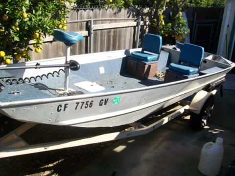 1968 Ford Mustang - Fishing boat on trailer with registration numbers visible on the hull.