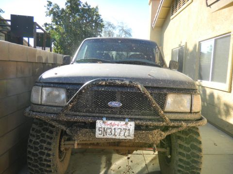 1997 Ford Ranger - This 1997 Ford Ranger is covered in mud, suggesting recent off-road use.