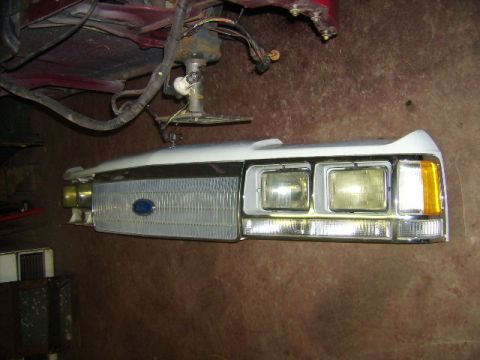 1988 Ford Crown Victoria LTD - Front clip of a 1988 Ford Crown Victoria, showing the grille and headlight assembly.