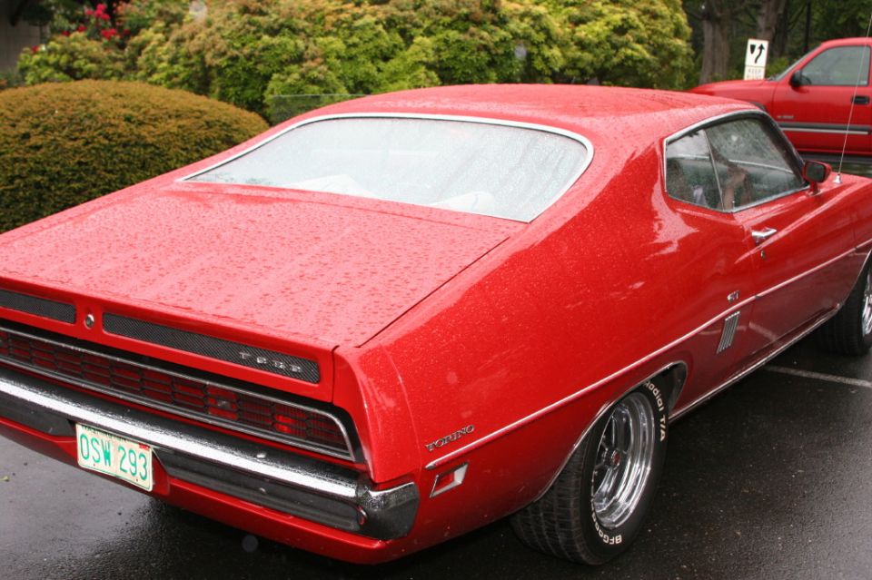 Red Ford Torino GT fastback, rear three-quarter, chrome wheels, Oregon plate