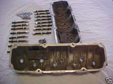 1972 Ford Ranchero - Engine valve covers and pushrods are laid out on a white cloth surface.
