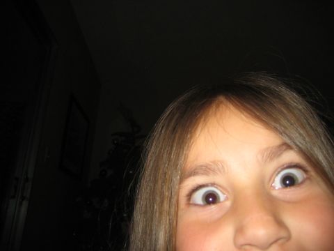 1996 Ford Bronco - A child's face is captured in a close-up shot with a dark background.