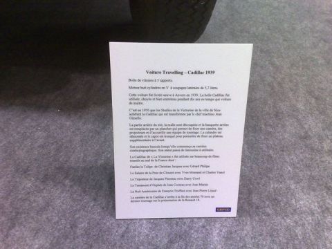 1991 Ford LTD Crown Victoria - French museum exhibit placard giving the history and specifications of a 1939 Cadillac camera-car.