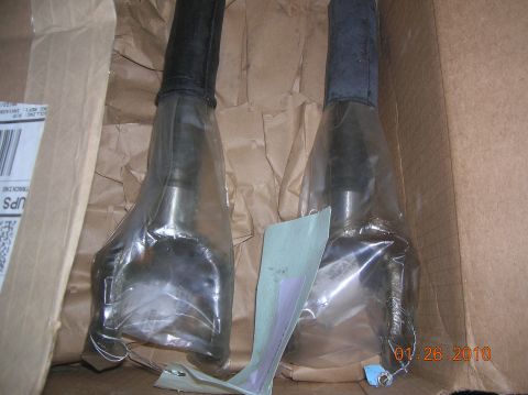 1985 Ford Bronco - Two CV axle shafts are shown packaged in plastic within a cardboard box, with a date stamp of 01-26-2010 visible.