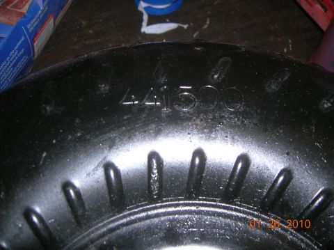 1985 Ford Bronco - Close-up of a black metal part showing the stamped numbers 441500 and a date stamp of 01-26-2010.