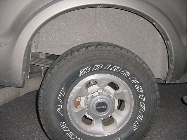 Modified F Code Rear with ONE added X G code Leaf. Leaf Added is the third leaf up from the bottom. See other pictures on cutting off the tip of one end of this G Code Leaf to fit the New F code spring Pack