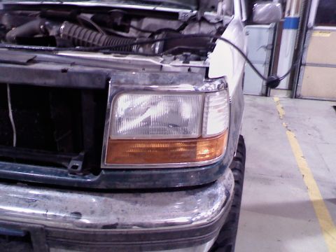 1996 Ford Bronco - Front view of a 1996 Ford Bronco showing the headlight and grille area.