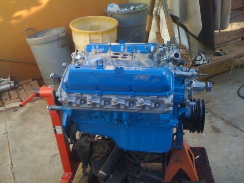 1979 Ford Bronco - A rebuilt V8 engine is mounted on an engine stand, ready for installation.