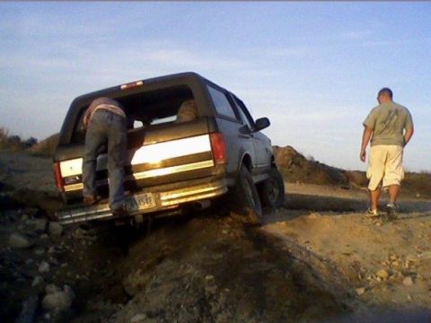 1994 Ford Bronco - Ford Bronco navigating a rough off-road trail.