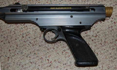 1994 Ford Bronco - This air pistol has a textured black grip and a silver body with horizontal lines.