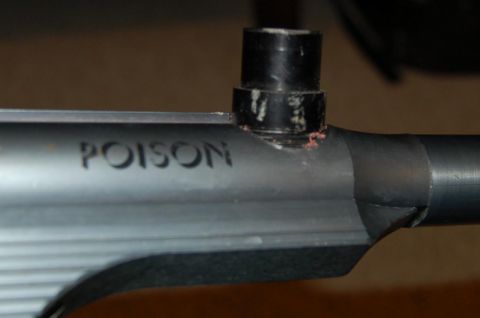 1994 Ford Bronco - A close-up view of a part with the word "POISON" engraved into its surface.